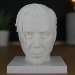 3D Bust of Till Lindemann, vocalist of Rammstein. Perfect for fans, it is white and measures 11 cm. Add it to your collection!